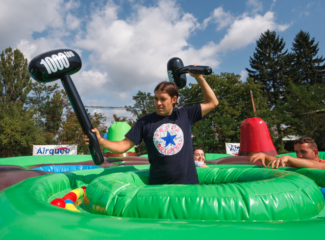 human whack a mole game for hire - Holey Moley inflatable