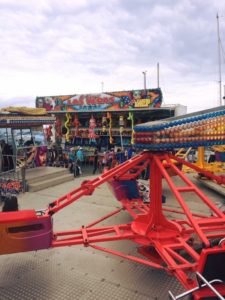 twister hire at funfair with fairground side talls