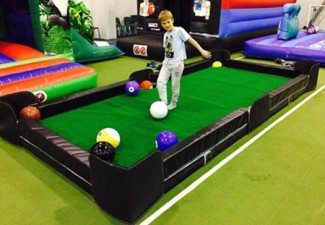 child playing footpool