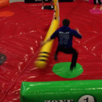 leg sweeper inflatable game hire